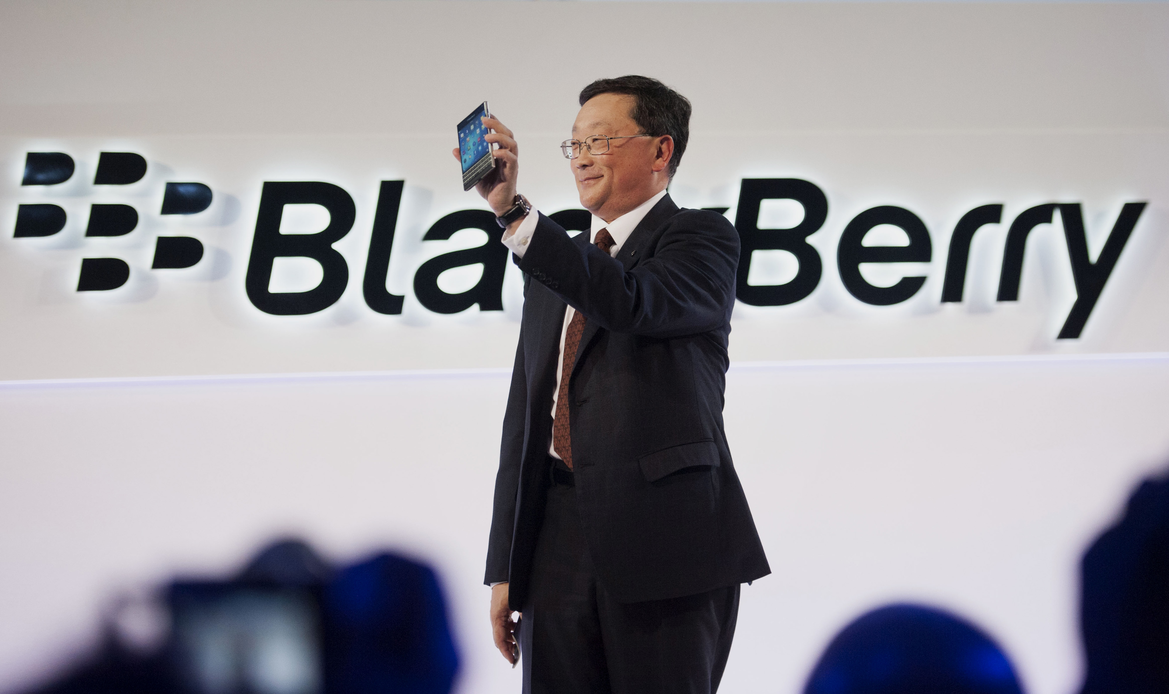 John Chen, chief executive officer of BlackBerry Ltd., displays the new Passport smartphone during a product announcement in Toronto, Ontario, Canada, on Wednesday, Sept. 24, 2014. The square-screened Passport is BlackBerry's first major new device slated for a global introduction since Chen set out in November to turn around the company by shifting away from the consumer market toward business and professional users. Photographer: Hannah Yoon/Bloomberg via Getty Images