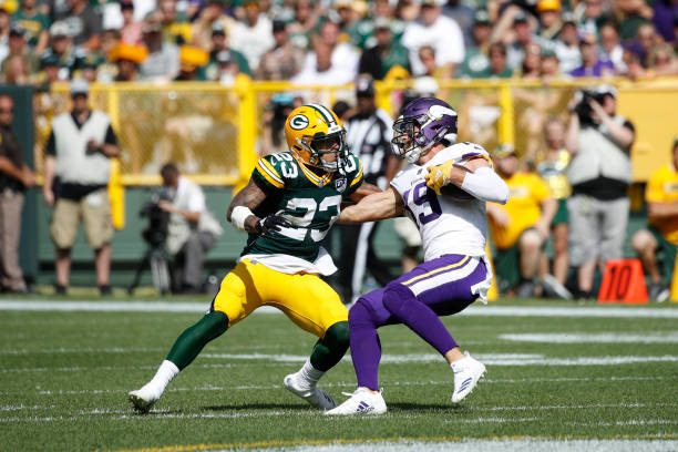 GREEN BAY, WI - SEPTEMBER 16: Jaire Alexander #23 of the Green Bay Packers tries to make a tackle against Adam Thielen #19 of the Minnesota Vikings during the game at Lambeau Field on September 16, 2018 in Green Bay, Wisconsin. The game ended in a 29-29 tie. (Photo by Joe Robbins/Getty Images)