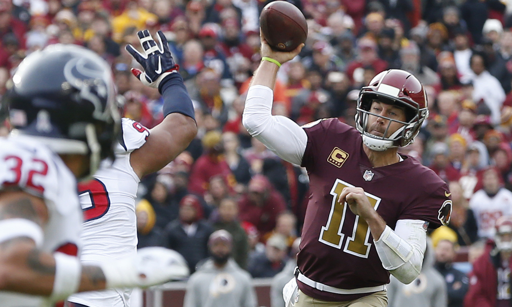 Nov 18, 2018; Landover, MD, USA; Washington Redskins quarterback Alex Smith (11) throws an interception that was returned for a touchdown by Houston Texans strong safety Justin Reid (not pictured) in the second quarter at FedEx Field. Mandatory Credit: Geoff Burke-USA TODAY Sports