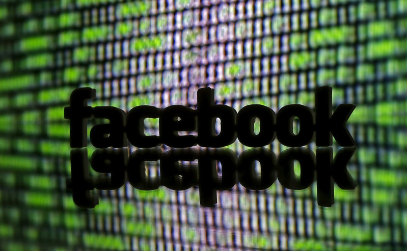 FILE PHOTO - A 3D printed Facebook logo is seen in front of displayed cyber code in this illustration taken March 22, 2016. REUTERS/Dado Ruvic/Illustration/File Photo