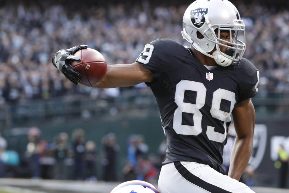 December 4, 2016 - Oakland, CA, U.S - NFL 2016. Oakland Raiders wide receiver Amari Cooper (89) 37-yard touchdown reception agains Buffalo Bills cornerback Kevon Seymour (29) in the second half from Derek Carr. (Photo by Paul Kuroda/Zuma Press/Icon Sportswire)