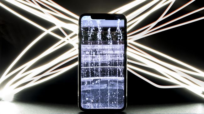Shimmering iPhone X with notch display.