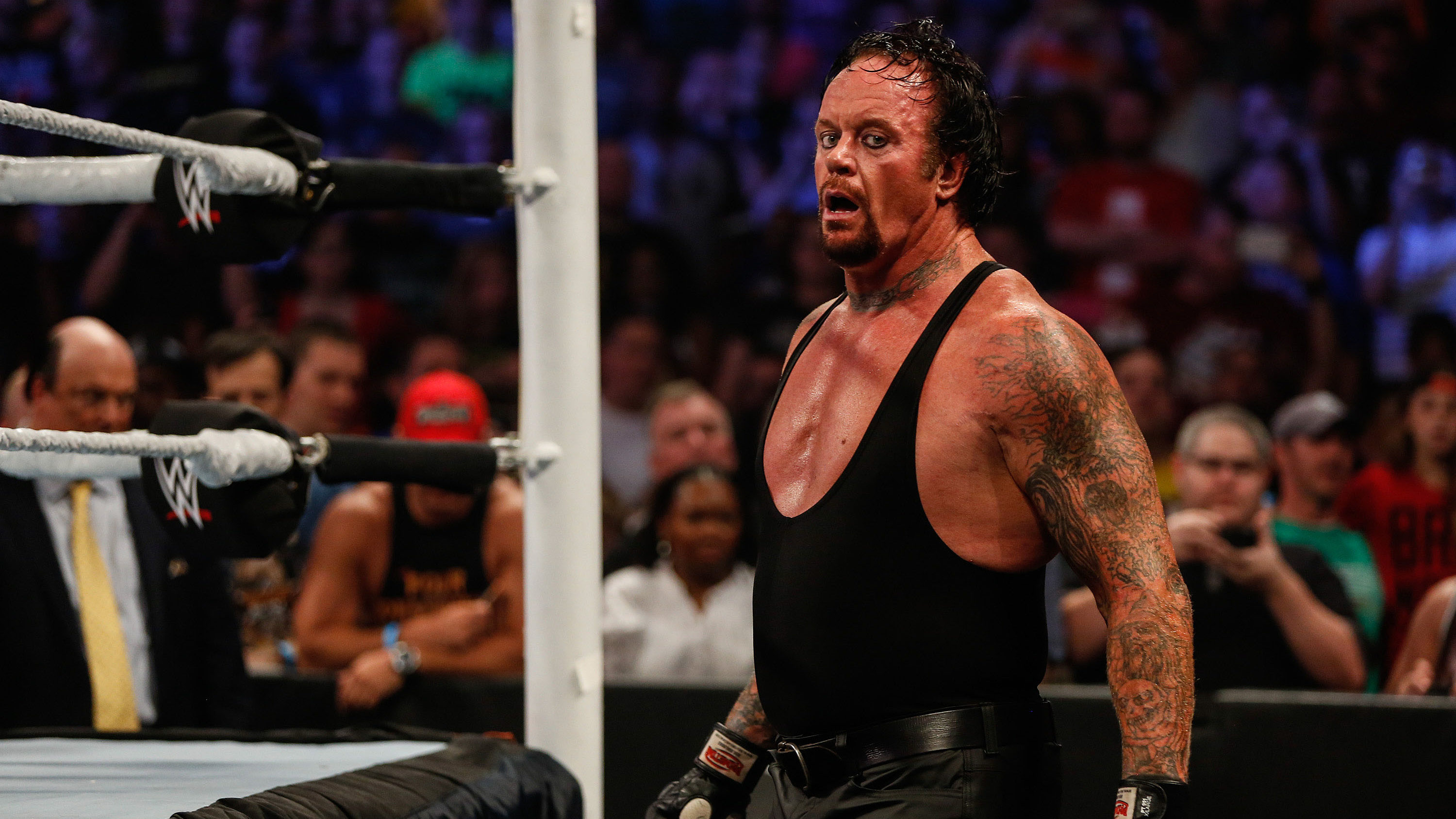 NEW YORK, NY - AUGUST 23: The Undertaker recovers during his fight against Brock Lesner at the WWE SummerSlam 2015 at Barclays Center of Brooklyn on August 23, 2015 in New York City.  (Photo by JP Yim/Getty Images)