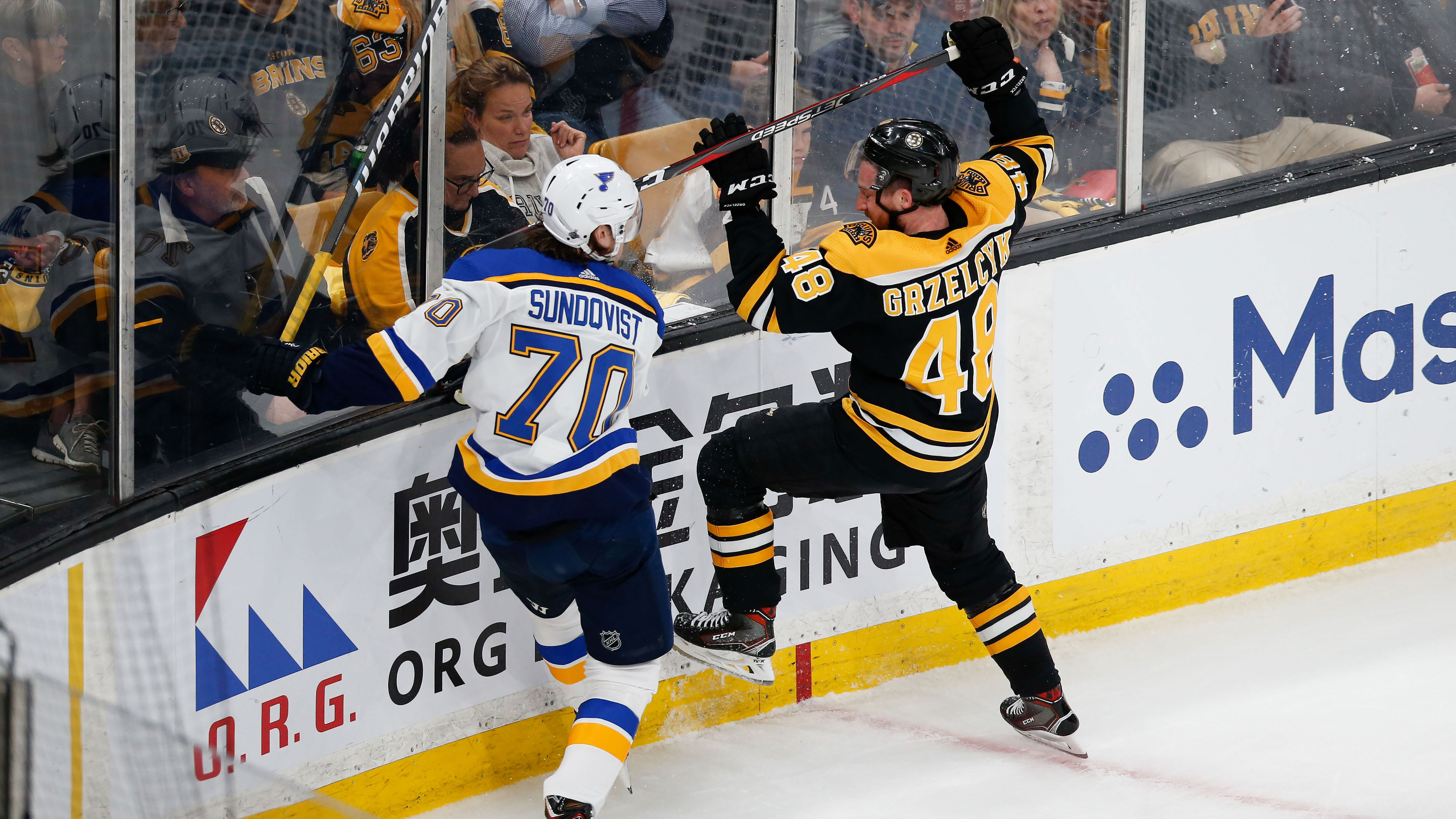 May 29, 2019; Boston, MA, USA;  St. Louis Blues center Oskar Sundqvist (70) boards Boston Bruins defenseman Matt Grzelcyk (48) during the first period in game two of the 2019 Stanley Cup Final at TD Garden. Mandatory Credit: Greg M. Cooper-USA TODAY Sports