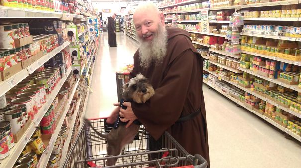 Monk takes a snap with the cute doggo at the supermart