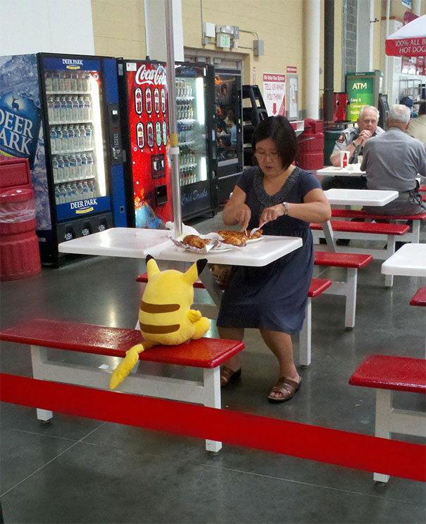 Costco lady enjoys the lunch date with Pikachu!