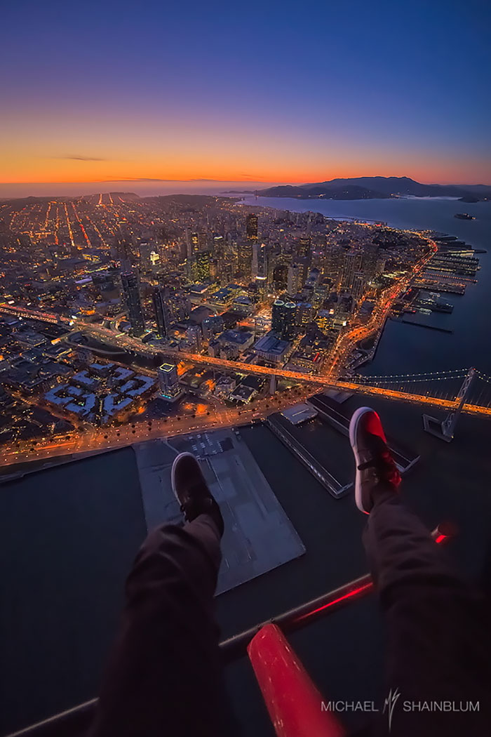 Hanging out of a helicopter for a different kind of “here are my feet” shot