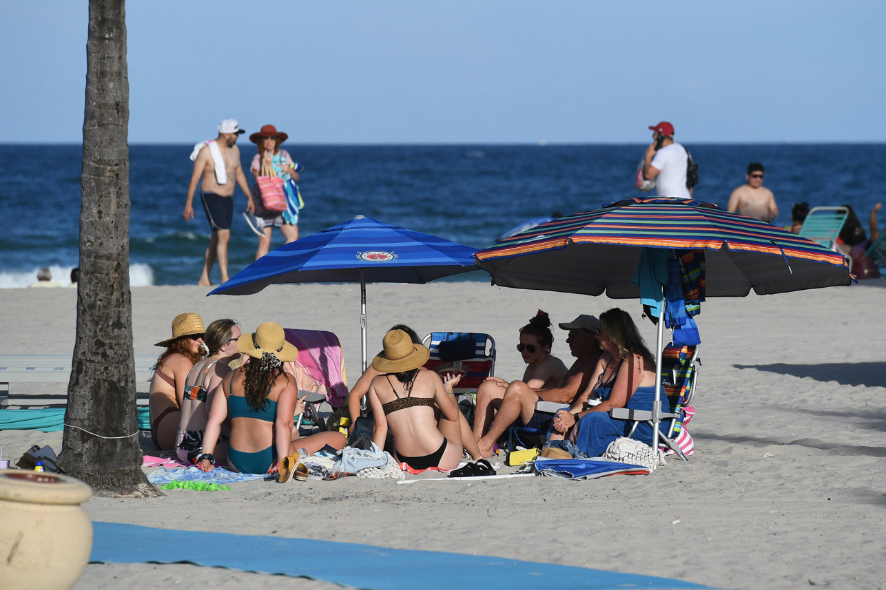 People walk freely on Florida beaches