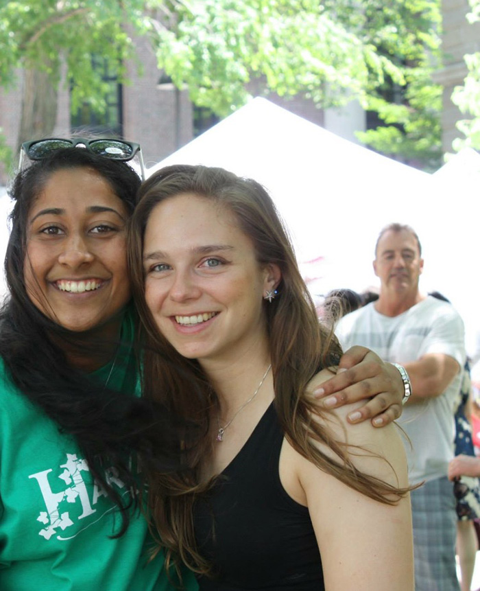 The Man In The Back Of His Picture Looks Like His Hand Is On The Girl's Shoulder