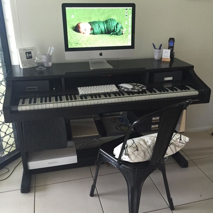 An old, broken piano could be used as a fully functional desk