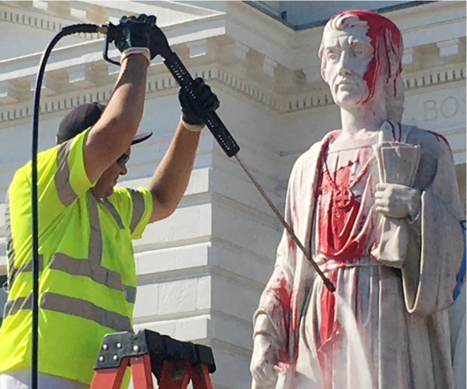 People protest to take down the statue of Christopher Columbus