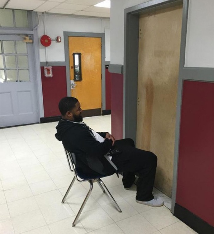 He is waiting for his female student to come out who is smoking in the washroom!