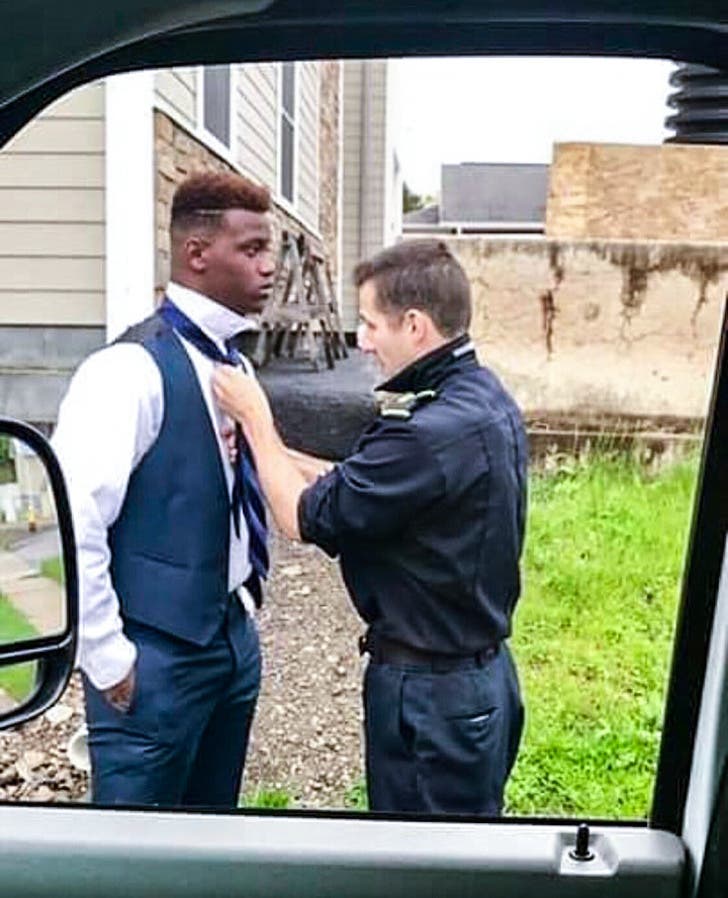 It was prom night and this young man approached a truck driver as he needed help doing up his tie