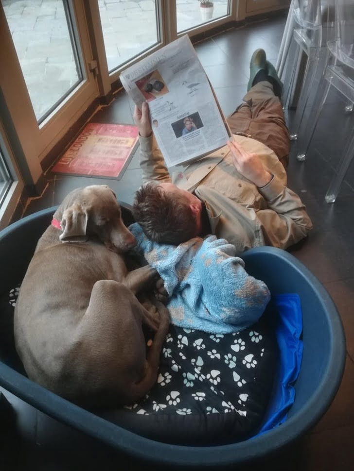 My dad reading the news with that dog