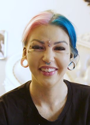 Amber Luke covers her tattoos with foundation