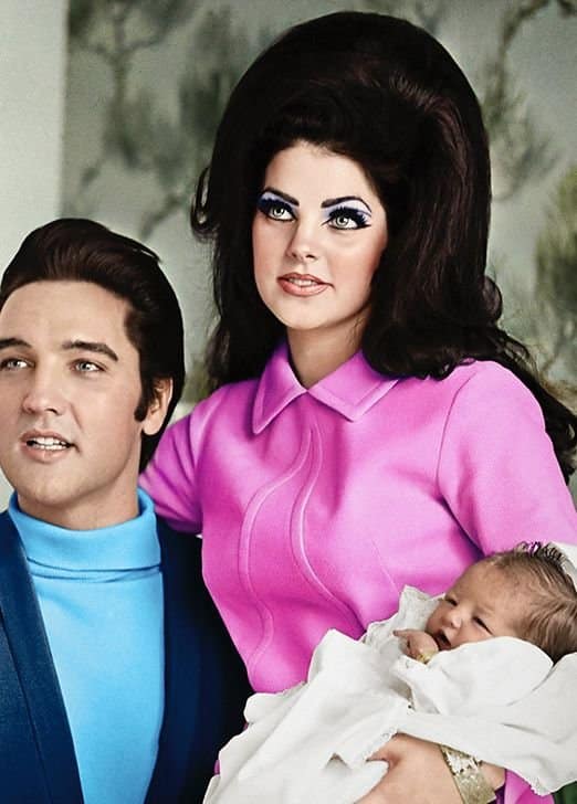 Elvis Presley and Priscilla Presley with their child