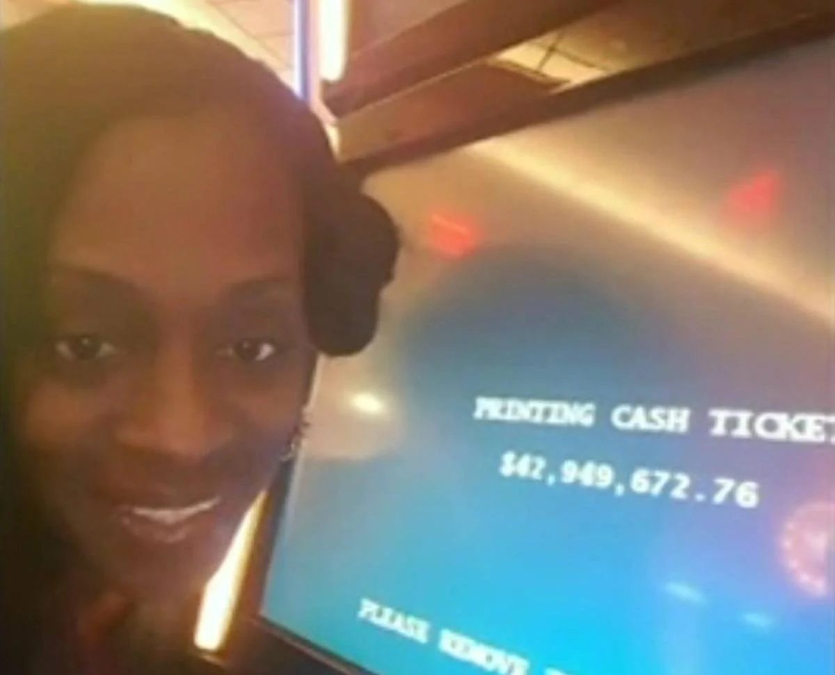 woman poses with slot machine