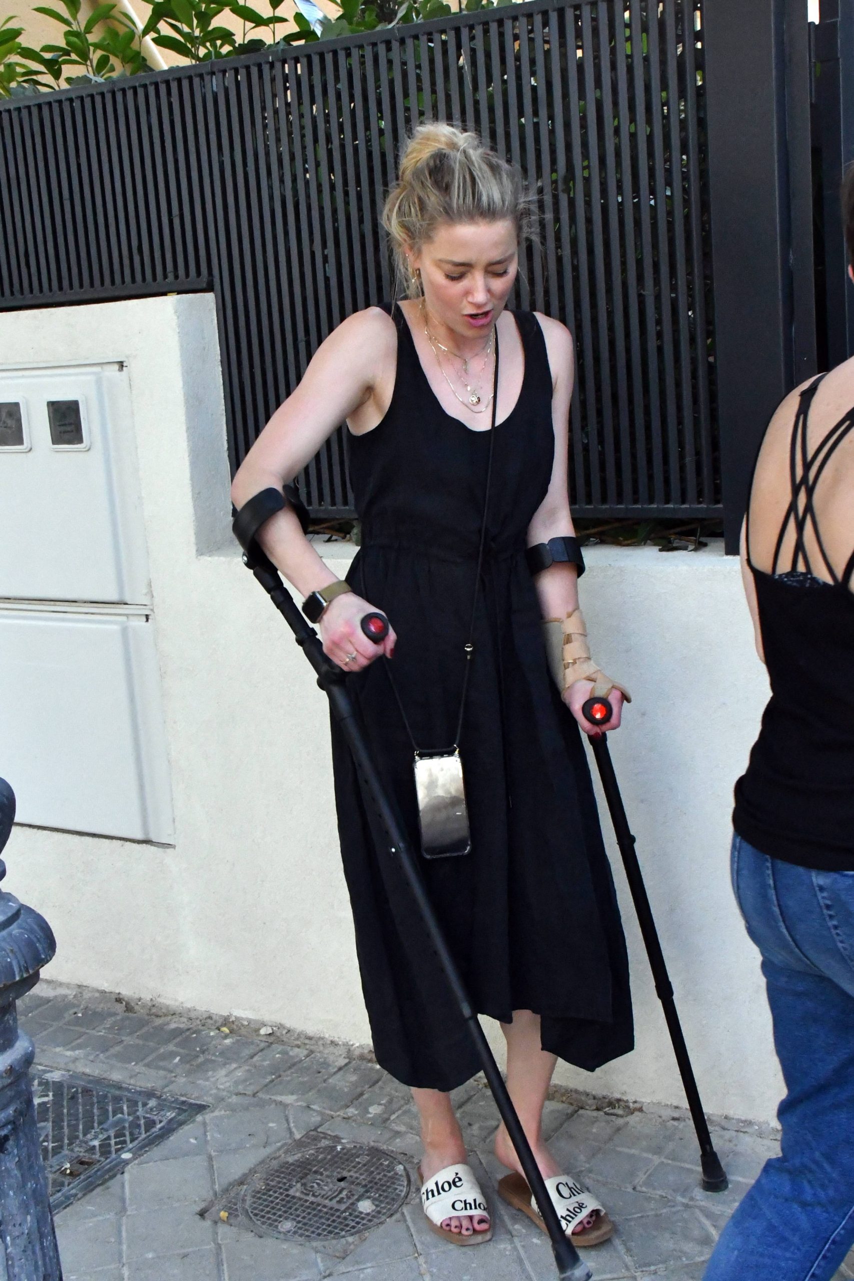 Amber Heard Braves Madrid Playground with Daughter, Leaning on Crutches after Marathon Training Mishap