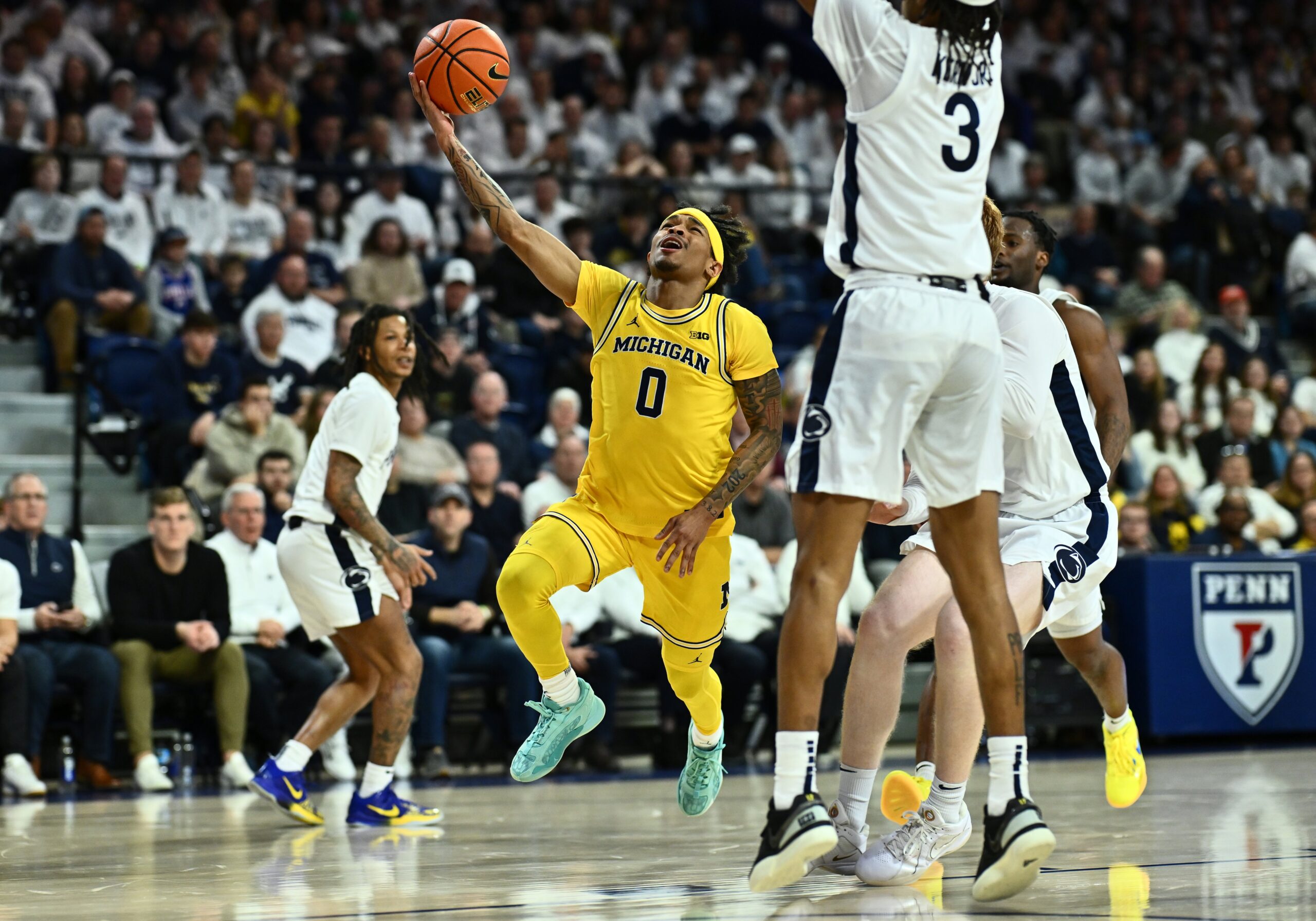 Michigan Hoops in Turmoil: Dug McDaniel's Road Game Ban Shakes Team's Core, Challenges Coach Howard