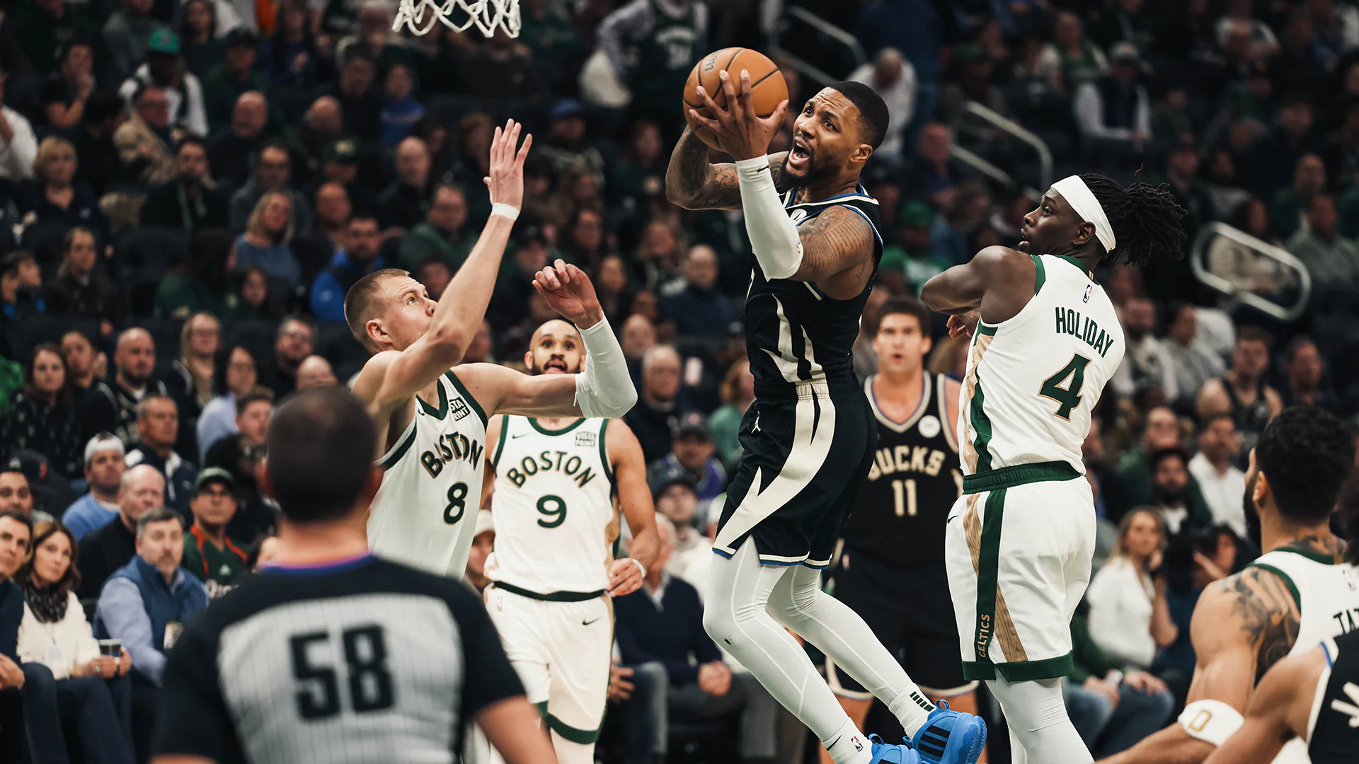 Milwaukee Bucks' Damian Lillard Hits Last-Second Three-Pointer, Giannis Celebrates Victory in Epic Overtime Thriller-