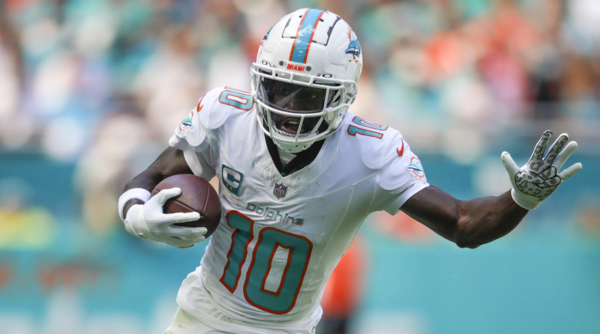 NFL Buzz Why Tyreek Hill is Fighting to Keep Jaylen Waddle from Leaving the Dolphins---