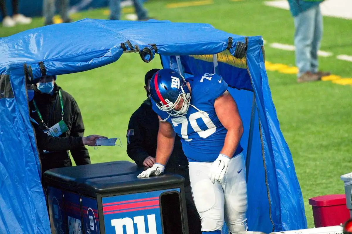 Unveiling the Secret How the NFL's Blue Tent Keeps Players Safe on the Field--