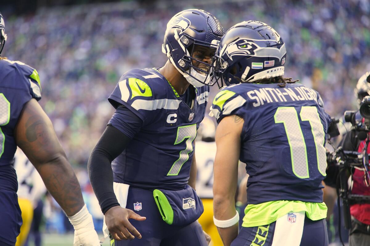 Seattle Seahawks' New Strategy Geno Smith Secures Starting Spot, Coach Macdonald Confirms Quarterback Plans---